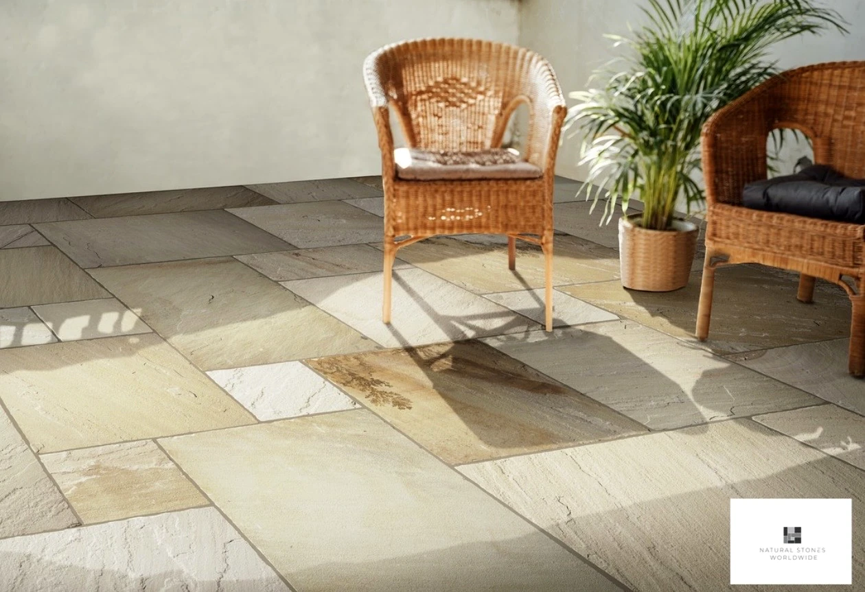 Warm natural stone paving in an inviting outdoor seating area